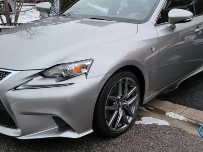 Silver Lexus IS after a winter exterior detail, snow on the ground